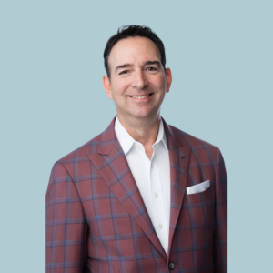 A man with a red suit smiling